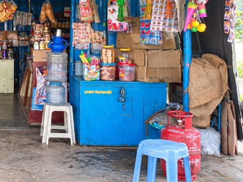 Blue storage counter and water station at Aavin Milk Shop Naidumangalam.